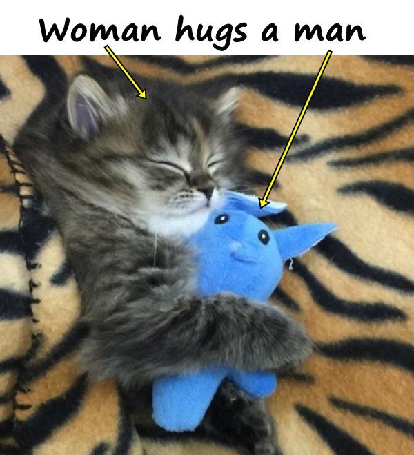 The woman hugs a man